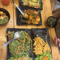 Mango salad, Sichuan tofu, green rice, fried enoki mushrooms   at Quán Chay An in Can Tho