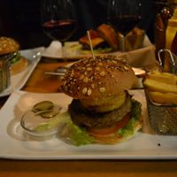 The burger I got, not entirely sure if everything on the burger was vegan besides the patty because they served it with a side of non-vegan sauce, which makes me think the onion rings could have a non-vegan batter.  at Zombie Bar in Madrid