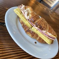 Croissant breakfast sandwich (holy shit, get this)  at Timeless Coffee Roasters and Bakery in Oakland