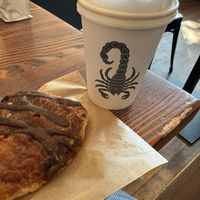 Chocolate croissant and coffee of the day   at Timeless Coffee Roasters and Bakery in Oakland