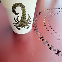 Pistachio cream latte on outside table   at Timeless Coffee Roasters and Bakery in Oakland
