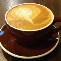 Almond milk latte with a vegan cinnamon roll.  Mmmmm at Seven Mile Cafe in Denton