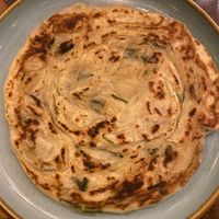 Bread, really tasty in between scallion pancake and nan.  at Navat in Almaty