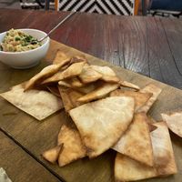 Tortilla chips with guacamole instead of cheese sauce  at Taqueria - Tacos & Drinks in Tallinn