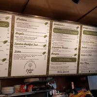 Vegan symbol is a lotus flower, as shown at the bottom of 4th panel from left at Cosmic Café in Philadelphia