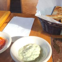 Pitas, with 2 vegan sauceson the left à spicy sauce and on the right a tahini sauce YUMMI at Abu Salim Middle Eastern Grill in San Francisco