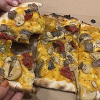 Pinsa vegana. The yellow is pumpkin, not fake cheese.  at We Pinsa - Mantova Valletta Valsecchi in Mantova