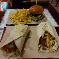 Vegan burrito and spicy onion vegan burger at St. Angus Burger Bar in Corinth