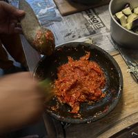 Mortar and pestle making Sambal  at Bu Herni's Cooking Course in Yogyakarta