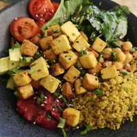 vegan Buddha bowl w/ curry tofu, tomatoes, spinach, fried chickpeas, avocado, quinoa and beet dip at Goji - The Hidden One in Lagos