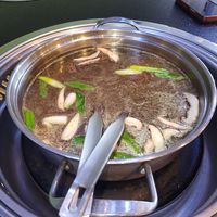 Mushroom broth at Lotus Hot Pot & Grill in Gladstone