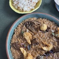 Adobo Risotto (front) with garlic rice (back)    at Kaya in Orlando