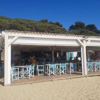 Shaded seating at Guingueta Cala Cristus in Girona