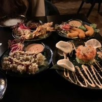 4 starters (up on the left a crispy wan tan, up on the right vegan tempura shrimps, down on the left tofu in cornflakes, down on the right vegan salmon with avocado) at IV in Berlin