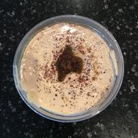 Small tub of hummus to go. Came with a side of warm pita bread which they said was also vegan. Good overall fresh taste. at Gyros Grill in Bloomington