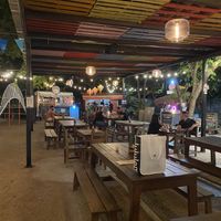 Plusieurs tables couvertes. Endroit sympathique!   at Palma Central in Tulum