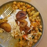 Chickpea and pumpkin curry with rice and fried plantain - delicious! at Flamenkana in Jerez