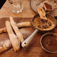 Desserts: pizza bread sticks with melted chocolate paste and hazelnut to dip into. at Martha Pizze Amore in Paris