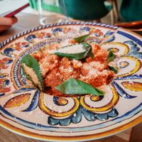 Norma Sbagliata, paccheri with tomato sauce, fried eggplant, vegan parmesan shavings and lots of basil at Martha Pizze Amore in Paris