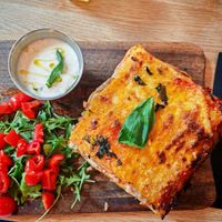 Homemade lasagna with vegan ham, vegan minced meat, purple eggplant, vean cheese and tomato sauce at Martha Pizze Amore in Paris