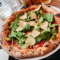 VEgan pizza STAR : Tomato sauce, plant-based mozzarella, plant-based sausage, gondino, garlic oil, fresh mint, baby spinach at Martha Pizze Amore in Paris