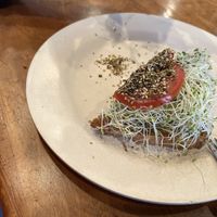 Got half before it was eaten.  My wife had avocado toast with sprouts, tomatoes & firikake on sourdough bread   at Sweet Cane Cafe in Hilo