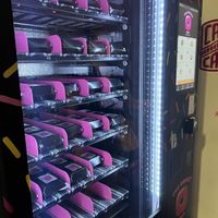 Donuts are on little conveyor belts   at The Donut Trap in St Paul