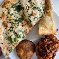 Vegan garlic and coriander naan + veggie selection  at Thindi  in Blackrock