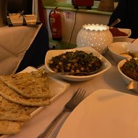 Chana Massala with veg-stuffed paratha, bindhi bhaji and mushroom rice  at Red Indigo in Hay-on-wye