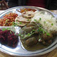 Thali of palak mushrooms, chana masala, beetroot pooriyal, chutney, basmati rice and chapati bread. at The Green Rocket Cafe in Bath
