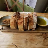 Warm bread, olive oil, and dukkah. at The Green Rocket Cafe in Bath