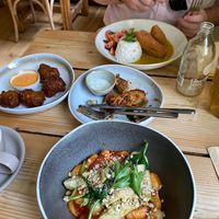 Gnocchi arrabiata (bottom), Katsu curry tofu (top), jalapeño and sweetcorn fritters (left), Tandoori marinated king oysters (middle) at The Green Rocket Cafe in Bath