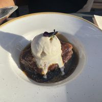 Sticky Toffee Pudding with Vanilla Ice Cream  at The Green Rocket Cafe in Bath