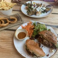 Gorgeous mushroom burgers, onion rings with vegan mayo, rosemary chips and a lovely aubergine dish with macadamia feta. at The Green Rocket Cafe in Bath