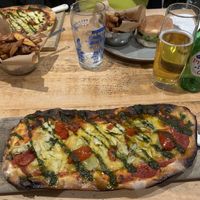 Vegan burger, vegan homemade cut chips and homemade vegan artichoke pizzas. The pizza is made in their pizza oven.  at The Castle Inn in Derby