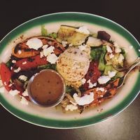 The hummus salad served with grilled seasonal vegetables, a dollop of hummus and sprinkled with feta at Brews N Bytes Internet Cafe and Eatery in Danville