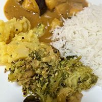 Aubergine curry, potato masala, broccoli thoran and rice   at Love Dosa in Inverness