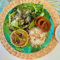 Menu of the day: Quiche, salad, onion rings, rice. at Alma Veg  in Carcavelos
