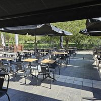 Outdoor patio overlooking the central park. at Pitaya in Andorra La Vella