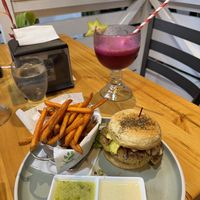 Vegan burger with sweet potato fries and dragon fruit drink   at The Green Spoon in La Fortuna