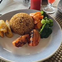 Sides: vegetables, plantains, tomatoes and coconut rice at The Bush Garden Seafood & Steakhouse in Nassau