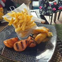 Sides: cajun fries, plantains and tomatoes at The Bush Garden Seafood & Steakhouse in Nassau