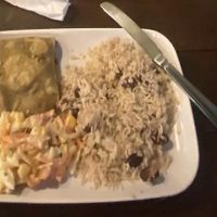 Mango and chickpea curry roti with rice and peas and vegan coleslaw   at D's Carib Kitchen in Brighton