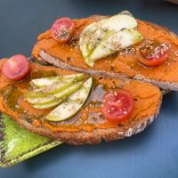 Tostadas de Hummus con tomate   at Dancing Coffee Shop in Granada