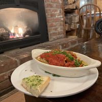 Vegan lasagna with garlic bread   at June Bug Cafe in Midpines