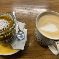 Mango chia pudding + a big latte with oat milk  at Parrot Coffee in Wroclaw