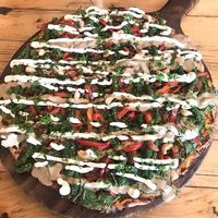 Vegan pizza with lashings of vegan aioli, pesto and tahini. Absolutely delicious  at Dangerous Kitchen in Takaka