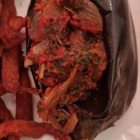 Aubergine farcie aux oignons avec des frites de patate douce at Les Frangins in Vienne