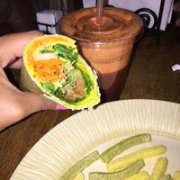 vegan wrap made with turmeric hummus, avocado, carrots, tomatoes, onion etc. fresh juice to with it.  at Island Natural Market in Saint Simons