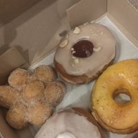 Cinnamon, peanut butter and jelly, mango tahin and pina colada. at Doughnut Disturb in Stockholm